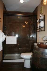 This was our bathroom- how cool is this?  Check out the re-invented barrel for our sink!  
